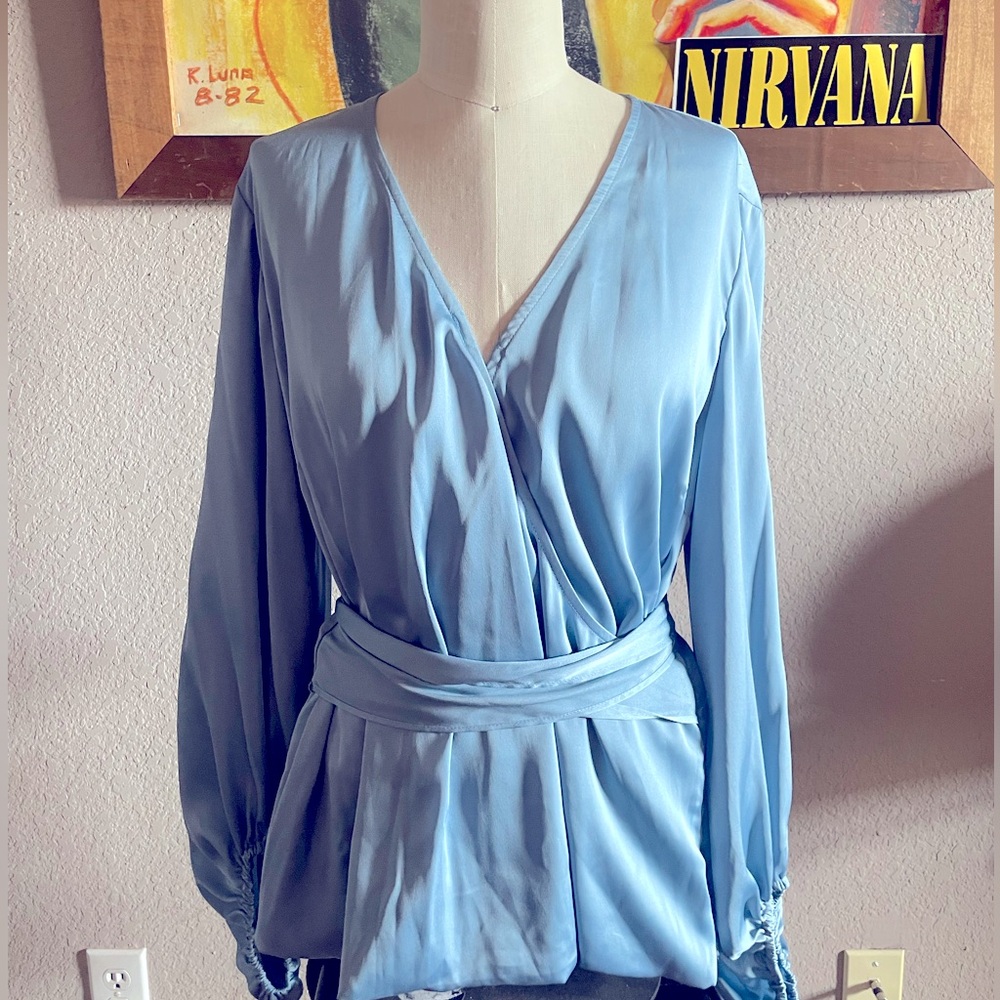 Baby blue silky blouse. Very pretty & exce condition.